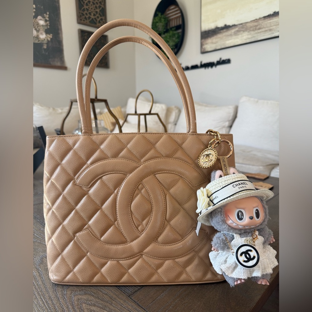 Auth CHANEL Beige Quilted Caviar Leather Medallion
Tote (Pre-Owned) with Labubu